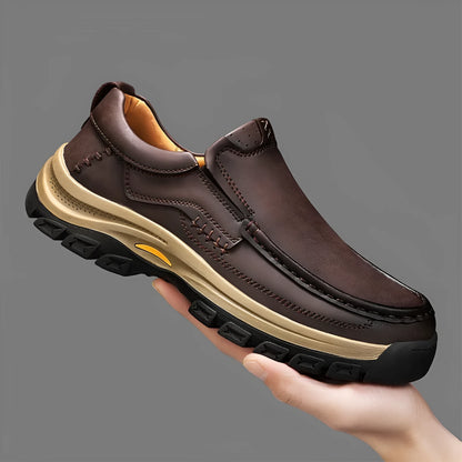 Men's black leather mountaineering shoes with thick rubber sole and round toe.