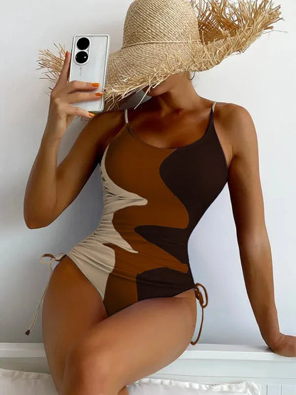 A blue one-piece swimsuit for women, showing sleeveless and backless design on a mannequin.