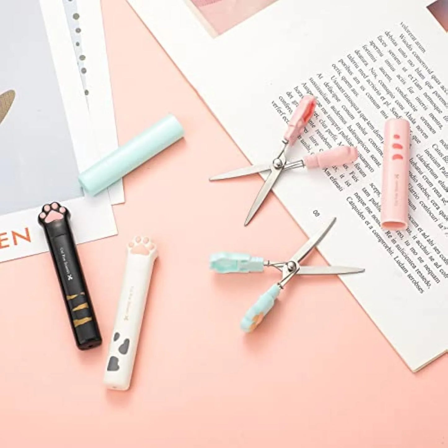 Closed and open views of cat paw mini folding scissors showing stainless steel blades and coloured handles.