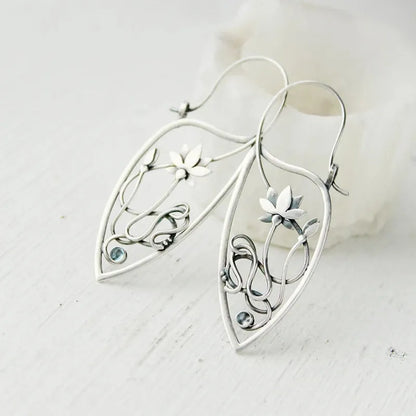 Silver electroplated alloy lotus vine earrings with geometric flower design and round rhinestone details