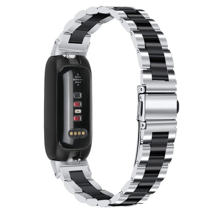 Three-bead stainless steel watch strap for Fitbit Inspire 3 in rose gold on a wrist