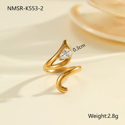 Geometric zircon ring showing round, oval and quadrangular design elements in stainless steel with electroplated finish