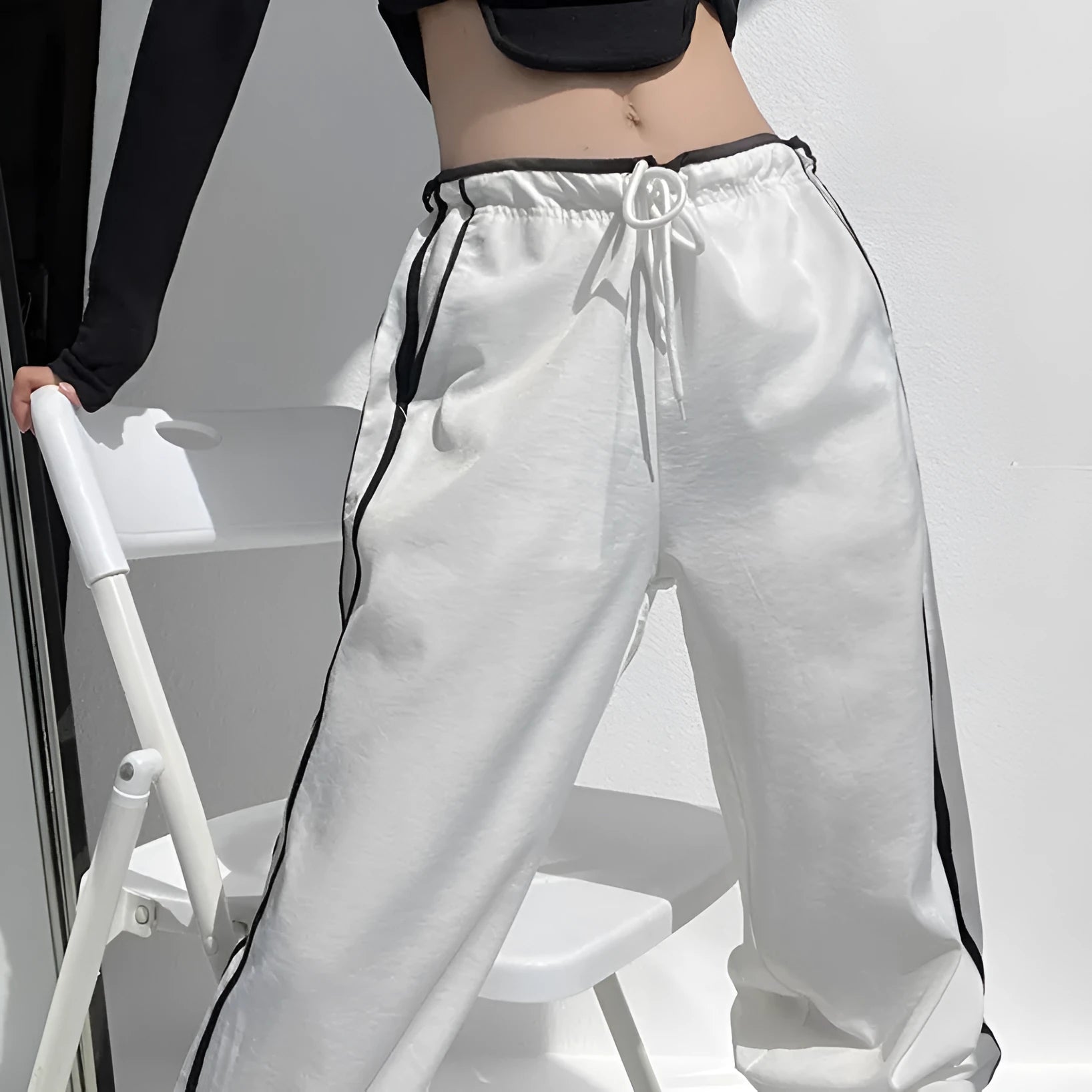 Women's loose straight leg trousers with ribbon parallel bars contrast colour detail on low waist, in thin fabric.