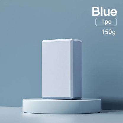 Blue EVA foam yoga block on a yoga mat, showing 23x15x7.6cm dimensions and textured surface for grip