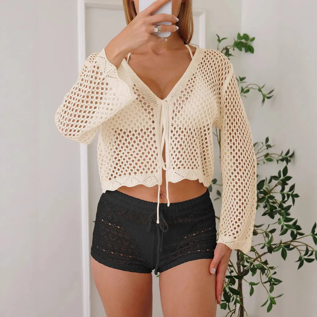 Women's hollow woven cardigan blouse with bell sleeves in apricot colour, showing textured fabric and nine-quarter sleeve length