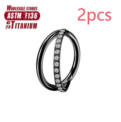 Pair of titanium alloy nose rings on a plain background showing silver, gold, black, and rose gold colour options.