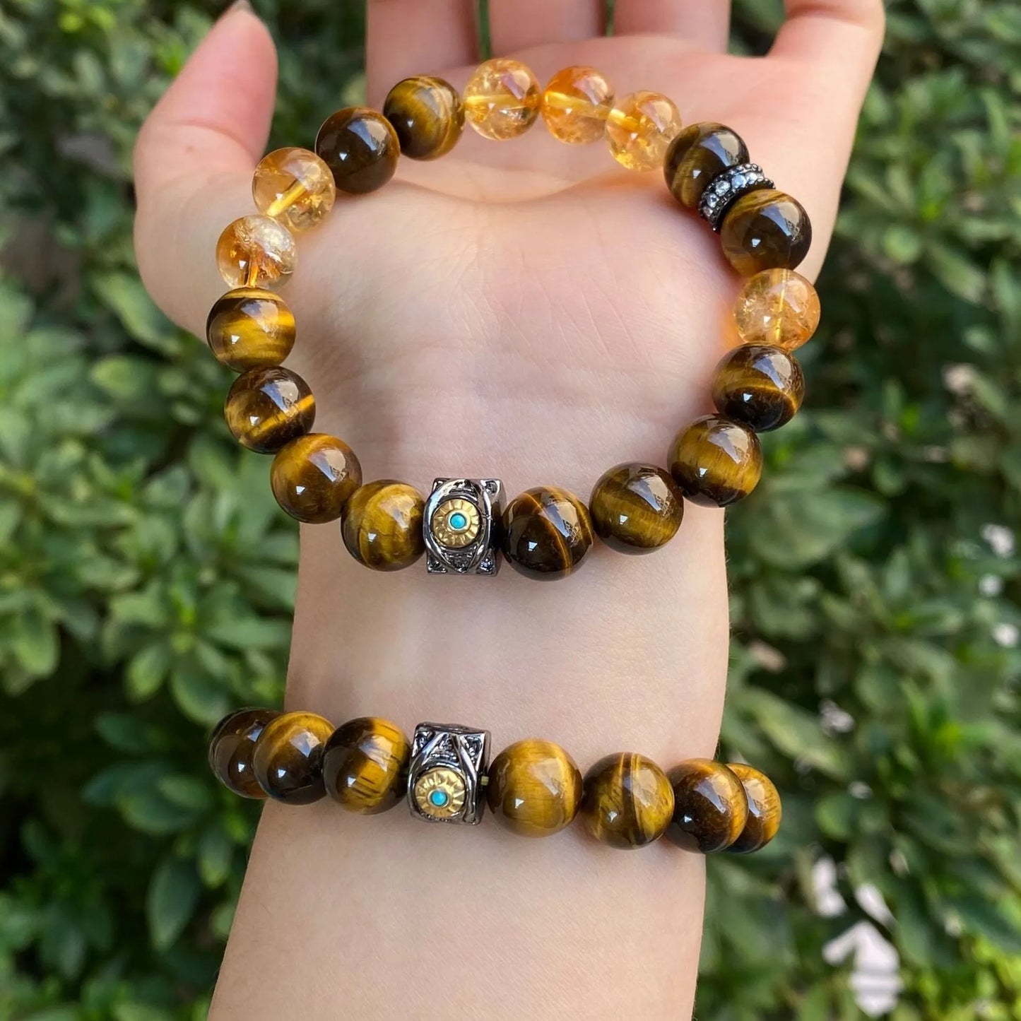 Handmade crystal bracelet with diamond gourd, disc, and prayer wheel beads in 8mm and 10mm sizes.