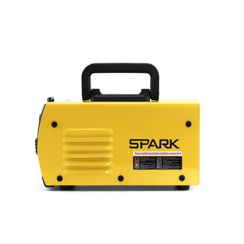 Small portable DC welding machine with red housing, welding tongs, and face shield on a workshop bench