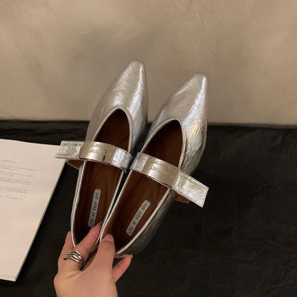 Women's silver Mary Jane buckle pumps with pointed toe and low flat heel, shown in black and wine red colours.