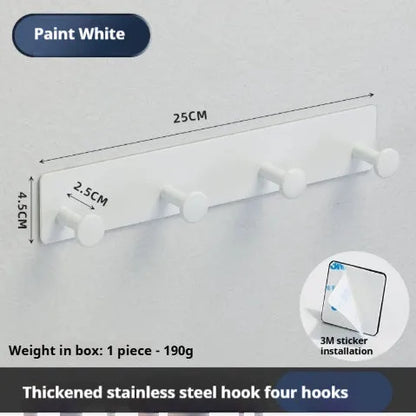 Screwless mushroom-style clothes hook with adhesive backing, shown in white on a tiled wall.