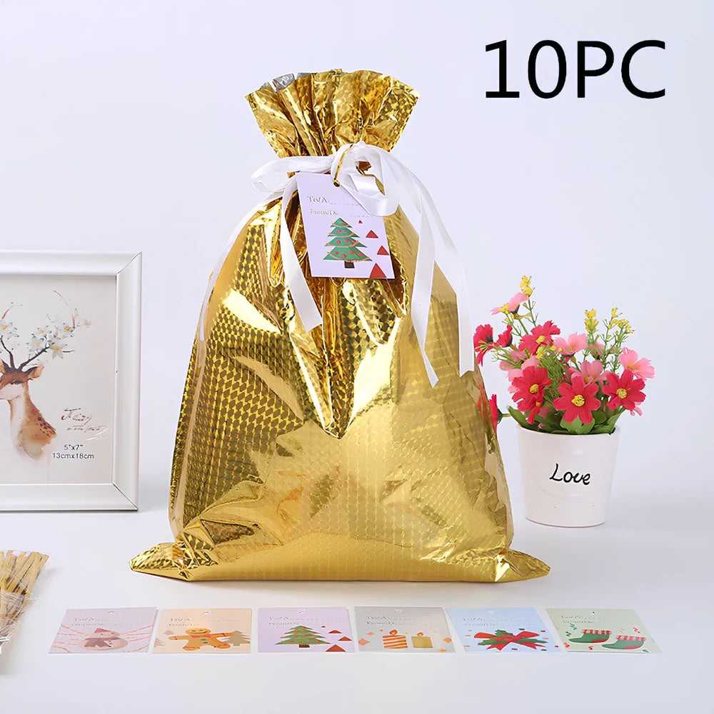 Christmas gift bag with drawstring closure in laser gold finish, 32x24cm dimensions