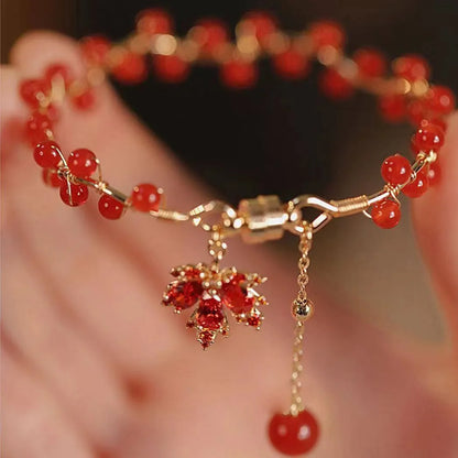 Red ginkgo leaf charm on an alloy magnetic bracelet with a natural Chinese style.