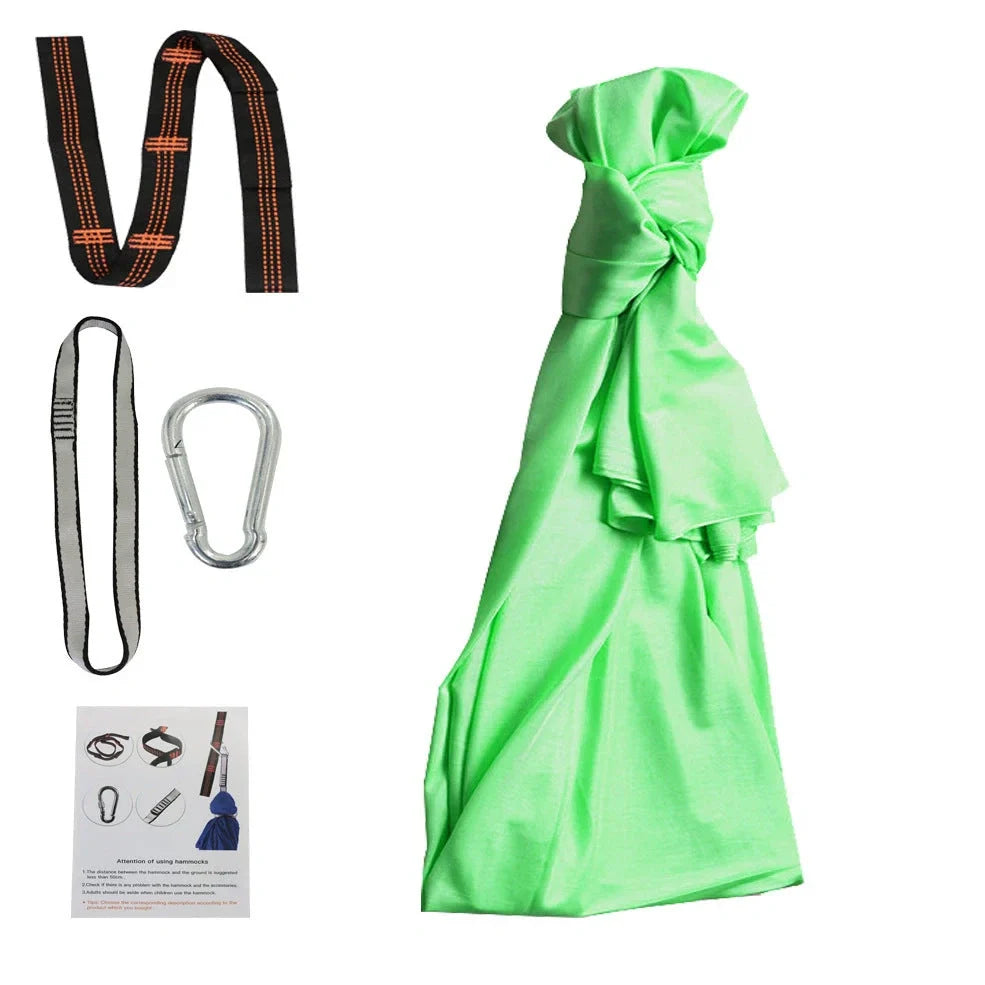 Child in black therapy swing cocoon with multi-loop daisy chain height adjustment system