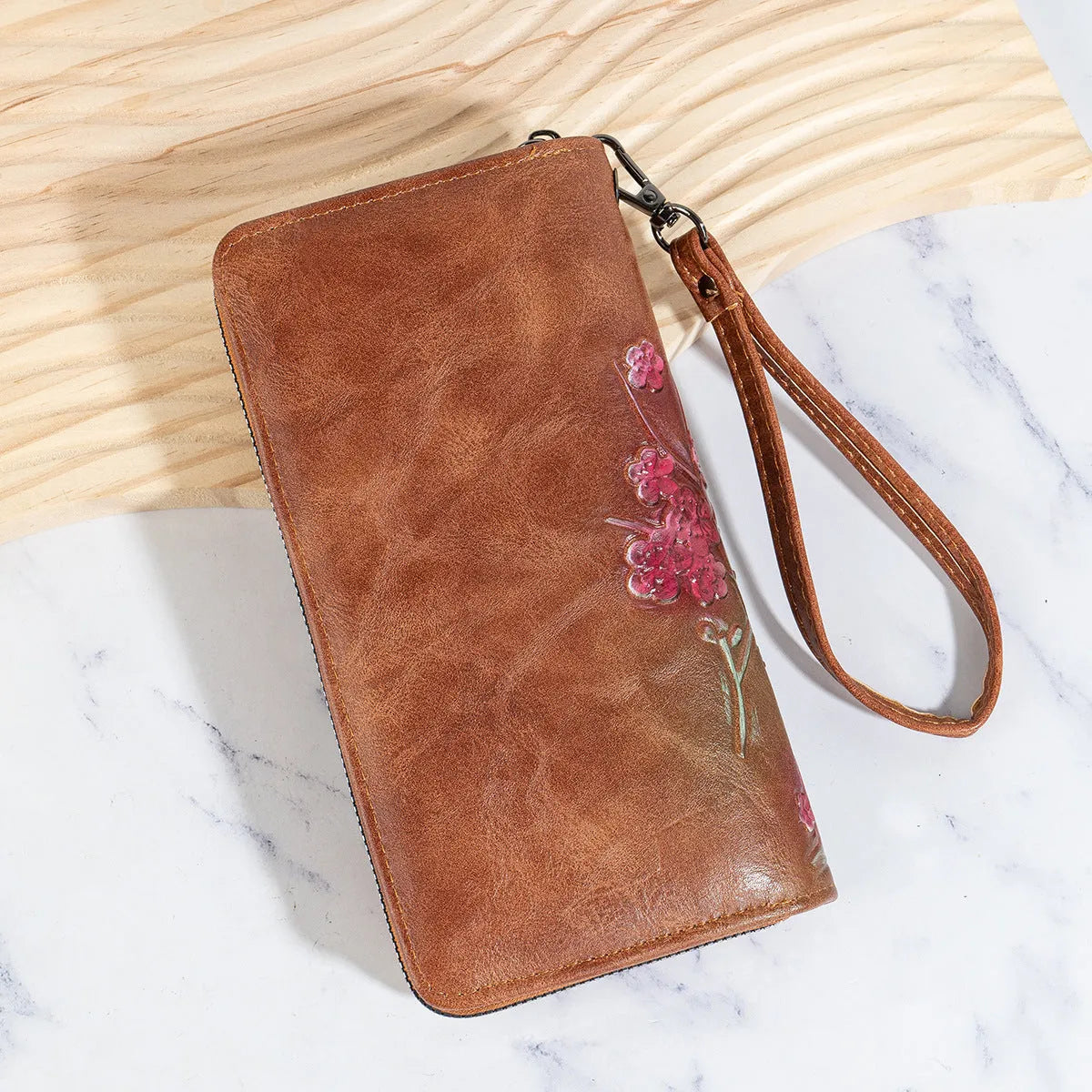 PU leather handbag with embossed floral pattern and zipper closure in Chinese style