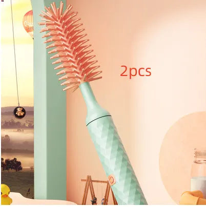 Electric baby bottle cleaning brush with rotating silicone head in pink or green colours