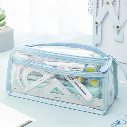 Transparent double-layer pencil case in blue showing organised stationery inside compartments
