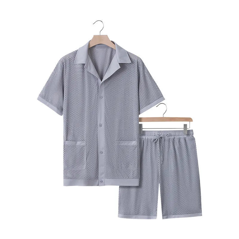 Women's lake blue see-through short sleeve cardigan and matching shorts beach cover-up set laid flat.