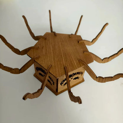 Tall wooden Halloween candlestick with spider cut-out illuminated by a safe, integrated LED light.