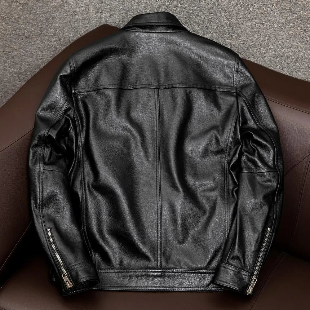 A black plus-size men's PU leather jacket with a lapel collar and side seam pockets on a hanger.