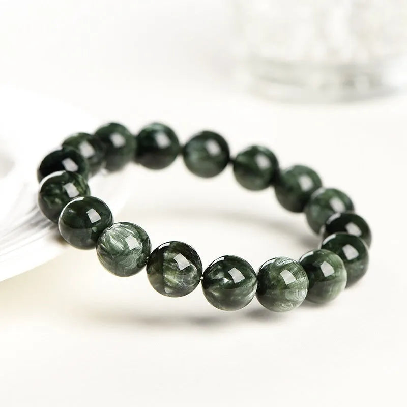 Green Dragon Crystal bracelet with 8-9mm geometry beads and Ruyi elements on wrist