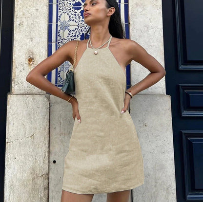 Women's solid colour linen A-line summer dress on hanger showing relaxed silhouette