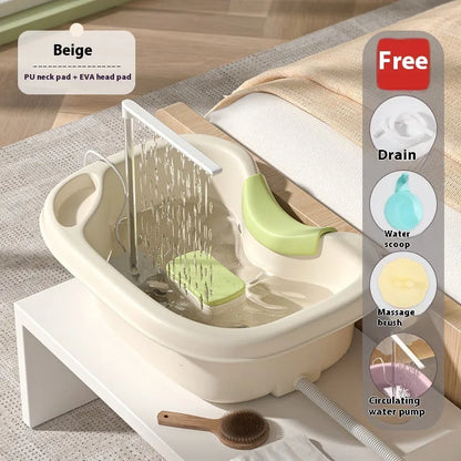 Portable plastic shampoo basin with neck pillow and water pump for bed hair washing.
