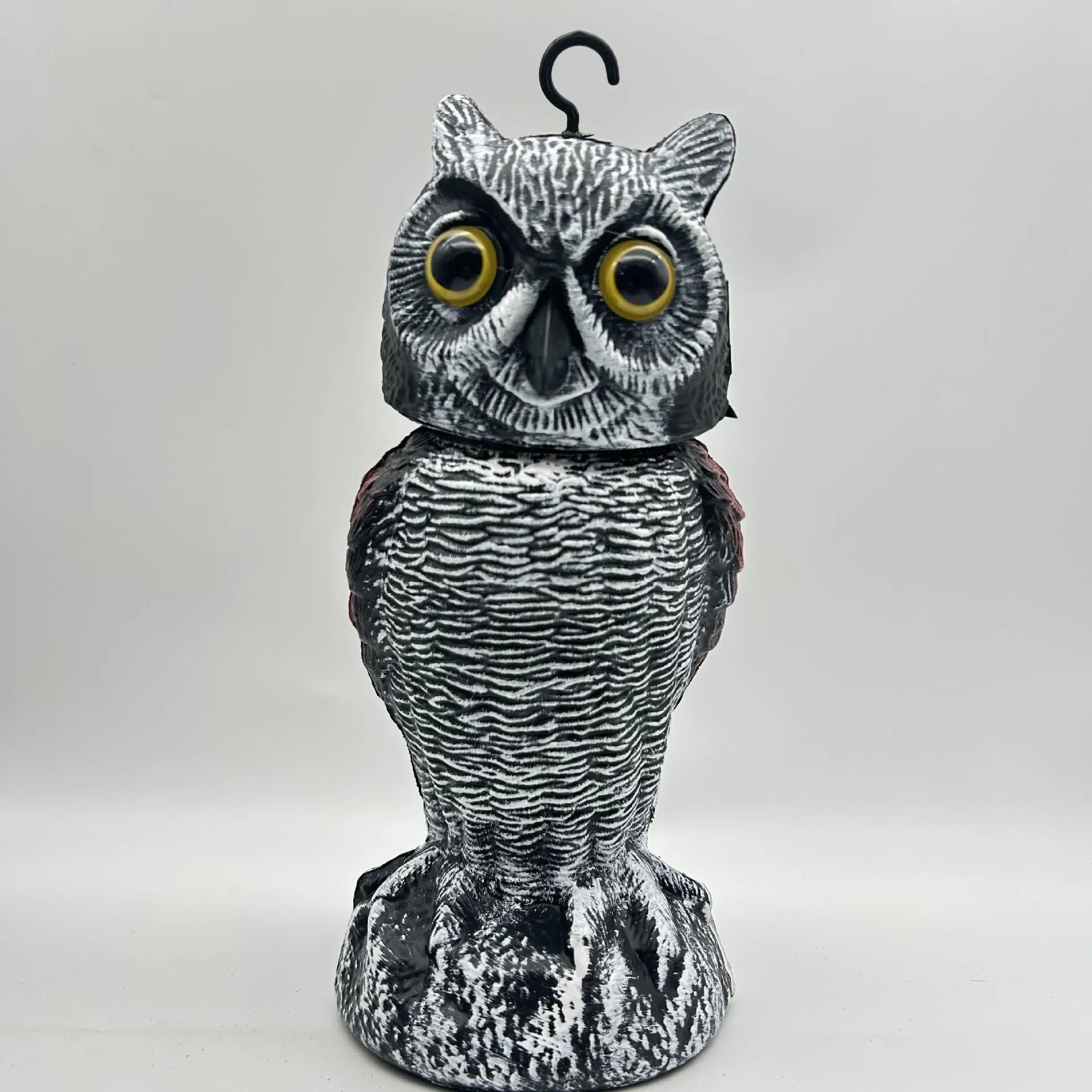 Set of artificial owl bait ornaments with shaking heads for scaring birds outdoors.