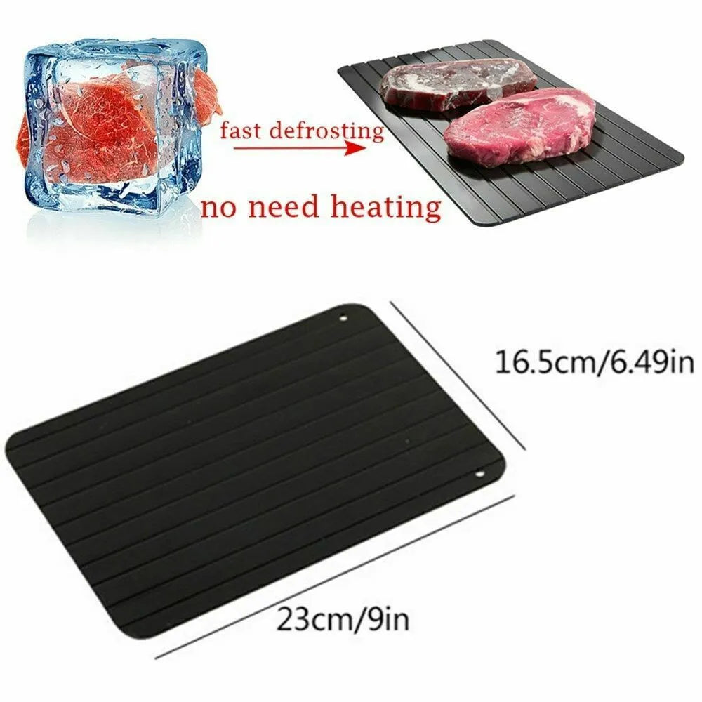 Black aluminium fast defrosting tray for thawing frozen food on kitchen counter