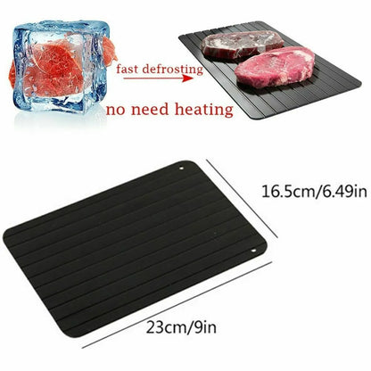Black aluminium fast defrosting tray for thawing frozen food on kitchen counter