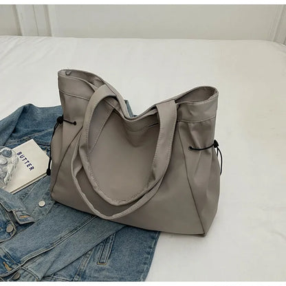 Soft Oxford cloth foldable commuter tote bag in street style, shown in multiple colour options.