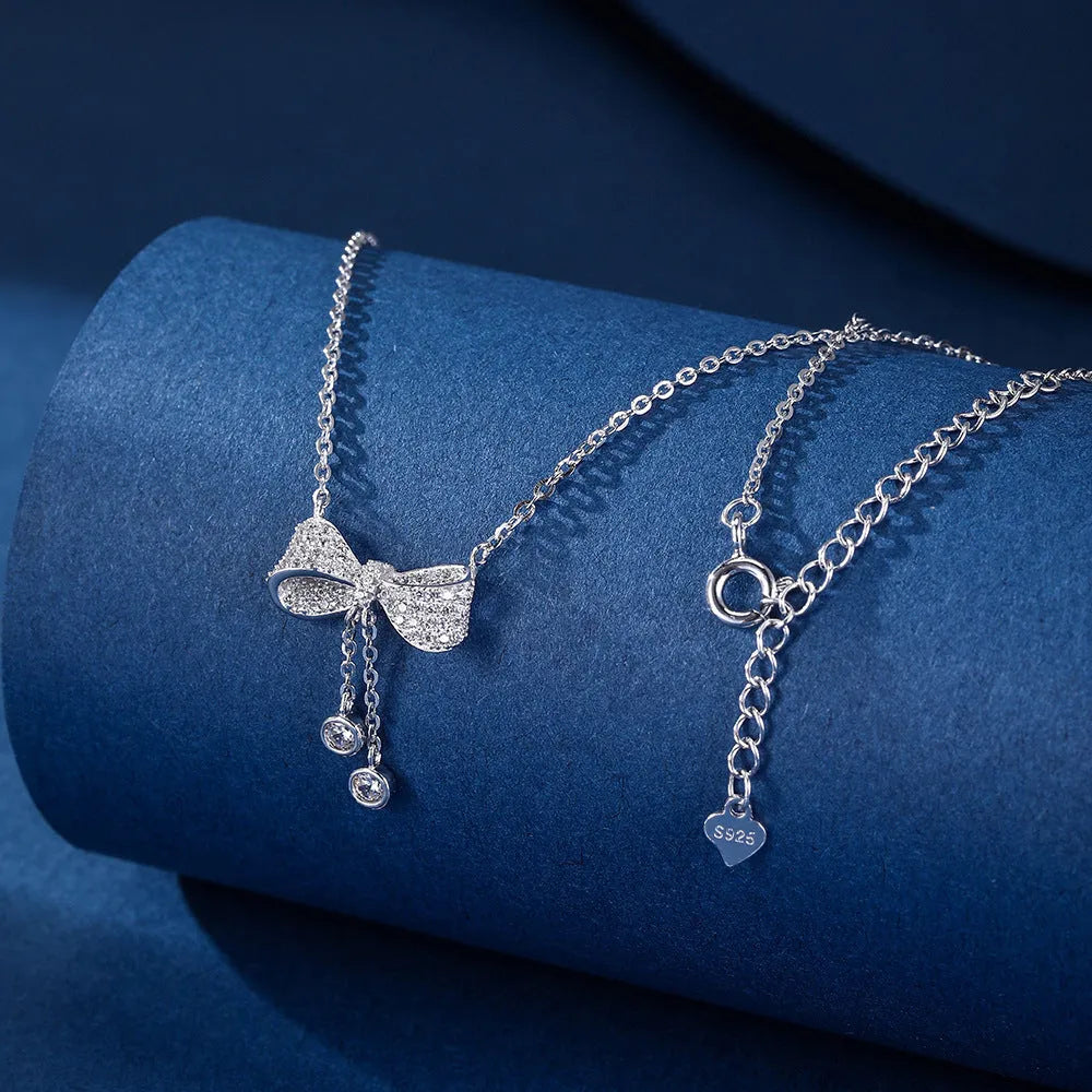S925 sterling silver bow pendant necklace on an O-ring chain, adjustable from 40cm to 45cm.