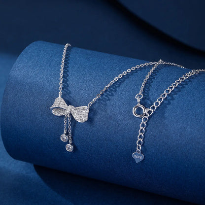 S925 sterling silver bow pendant necklace on an O-ring chain, adjustable from 40cm to 45cm.