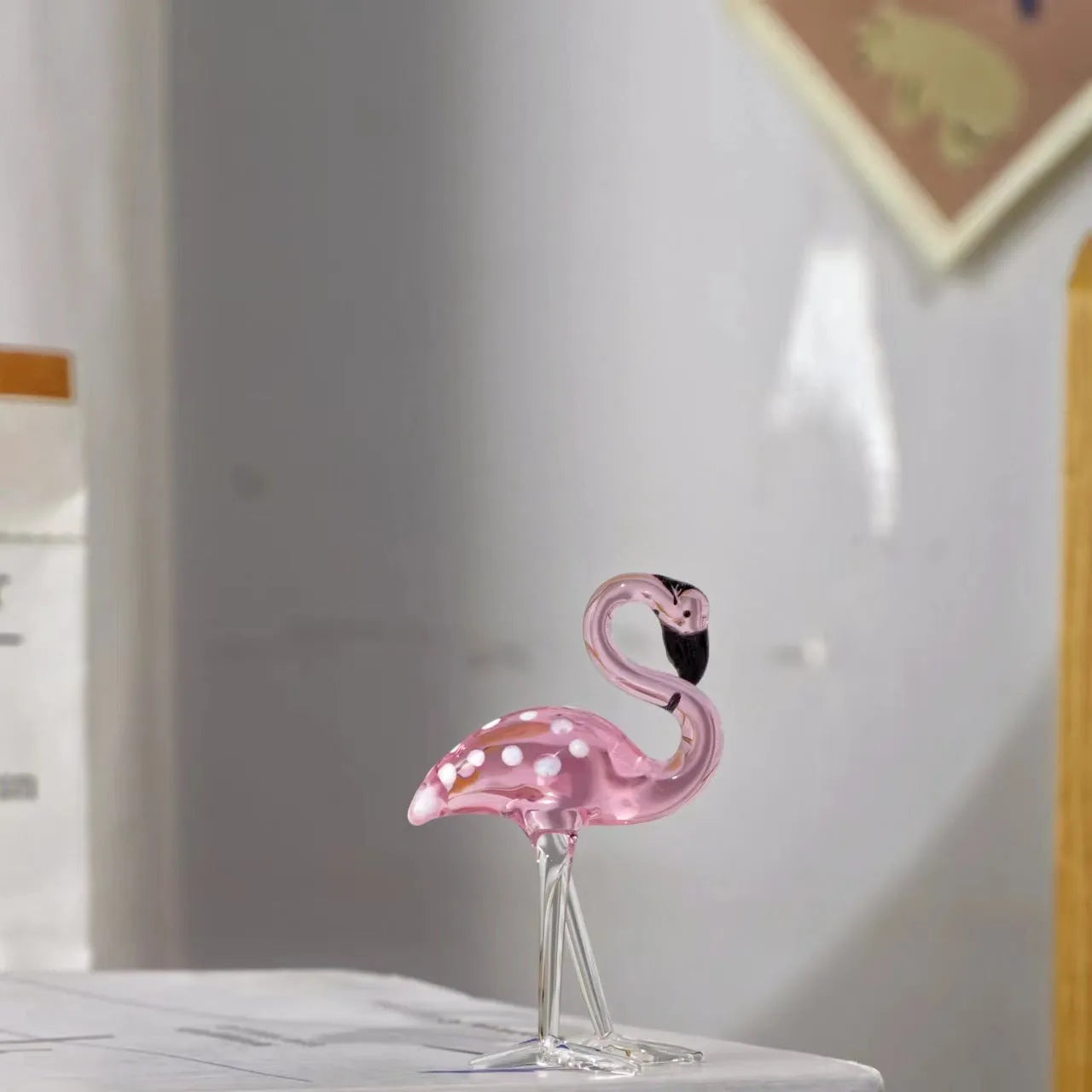 Pink crystal flamingo decorative ornament on table, 15cm tall with modern simplicity design