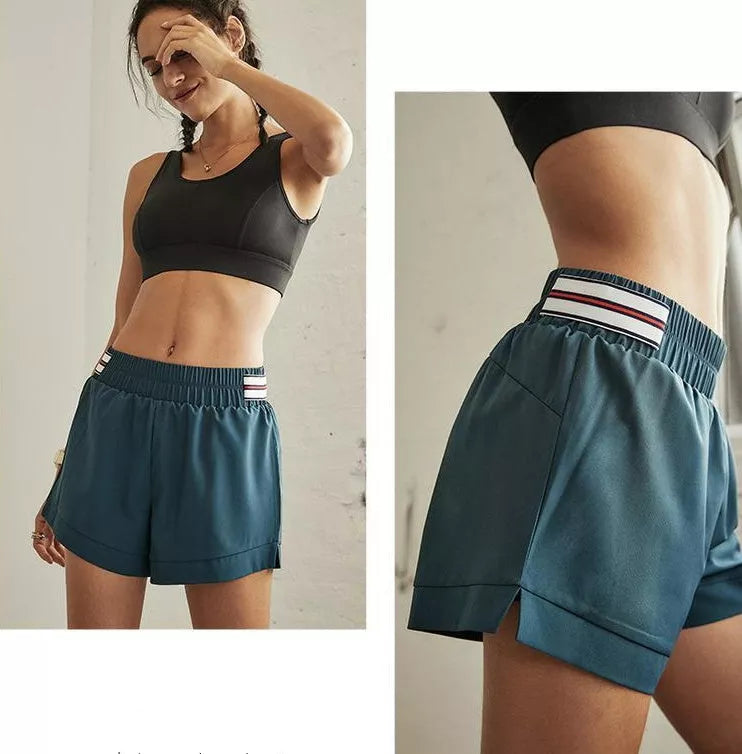 Female fitness yoga shorts in green, made with 95% polyester fiber blend for durability and comfort