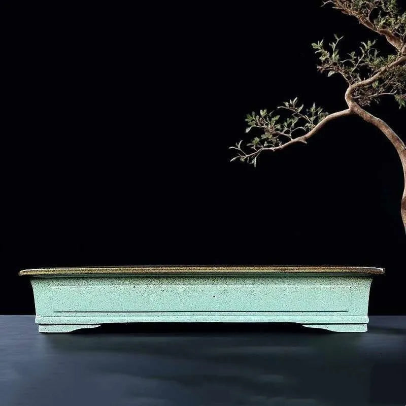 Green ceramic bonsai pot with purple sand crackled glaze finish, 15cm diameter plant container on wooden surface