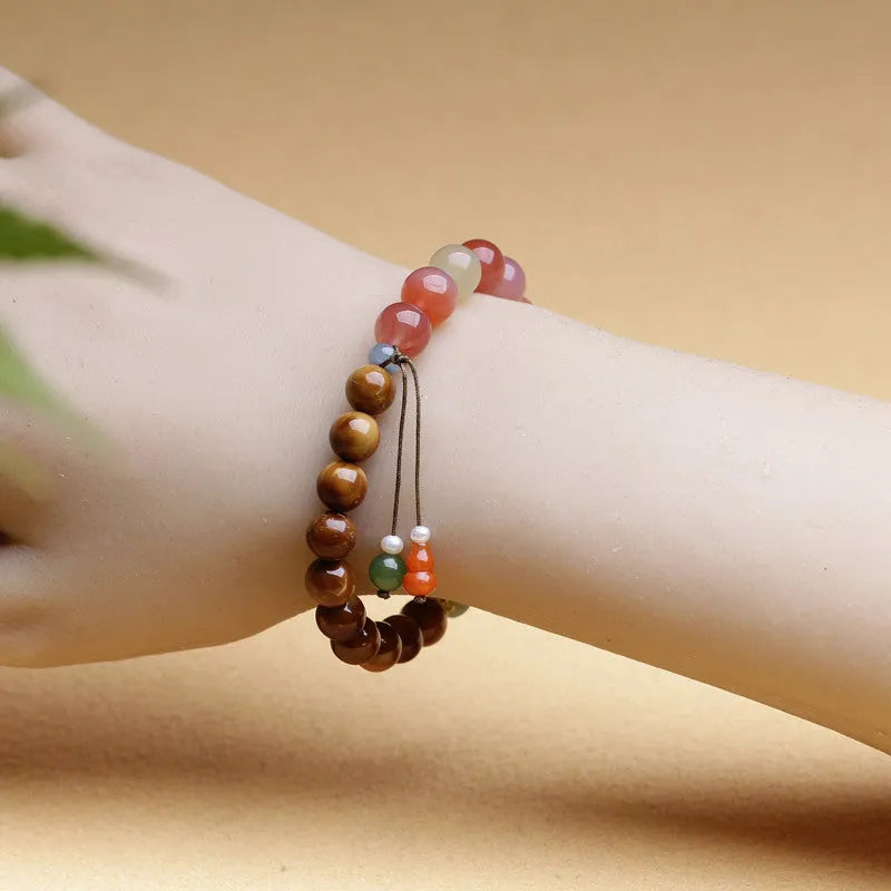8mm Hetian jade agate bracelet showing diamond-shaped persimmon design elements on natural stone