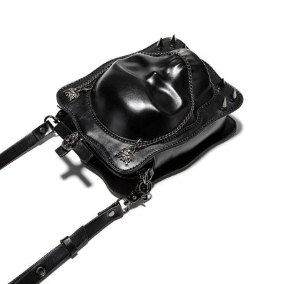 Black mini square messenger bag with embossed skull design, metal chains, and crossbody strap