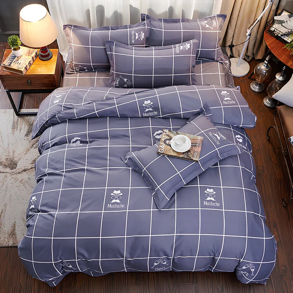 Three-piece cotton bedding set with blue geometric pattern showing duvet cover, fitted sheet, and two pillowcases on a UK double bed