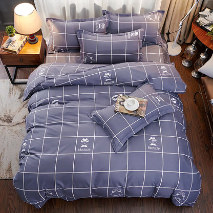 Three-piece cotton bedding set with blue geometric pattern showing duvet cover, fitted sheet, and two pillowcases on a UK double bed