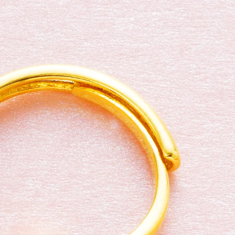 Women's adjustable copper ring with Vietnam placer gold zircon stones in six colour options showing adjustable opening mechanism