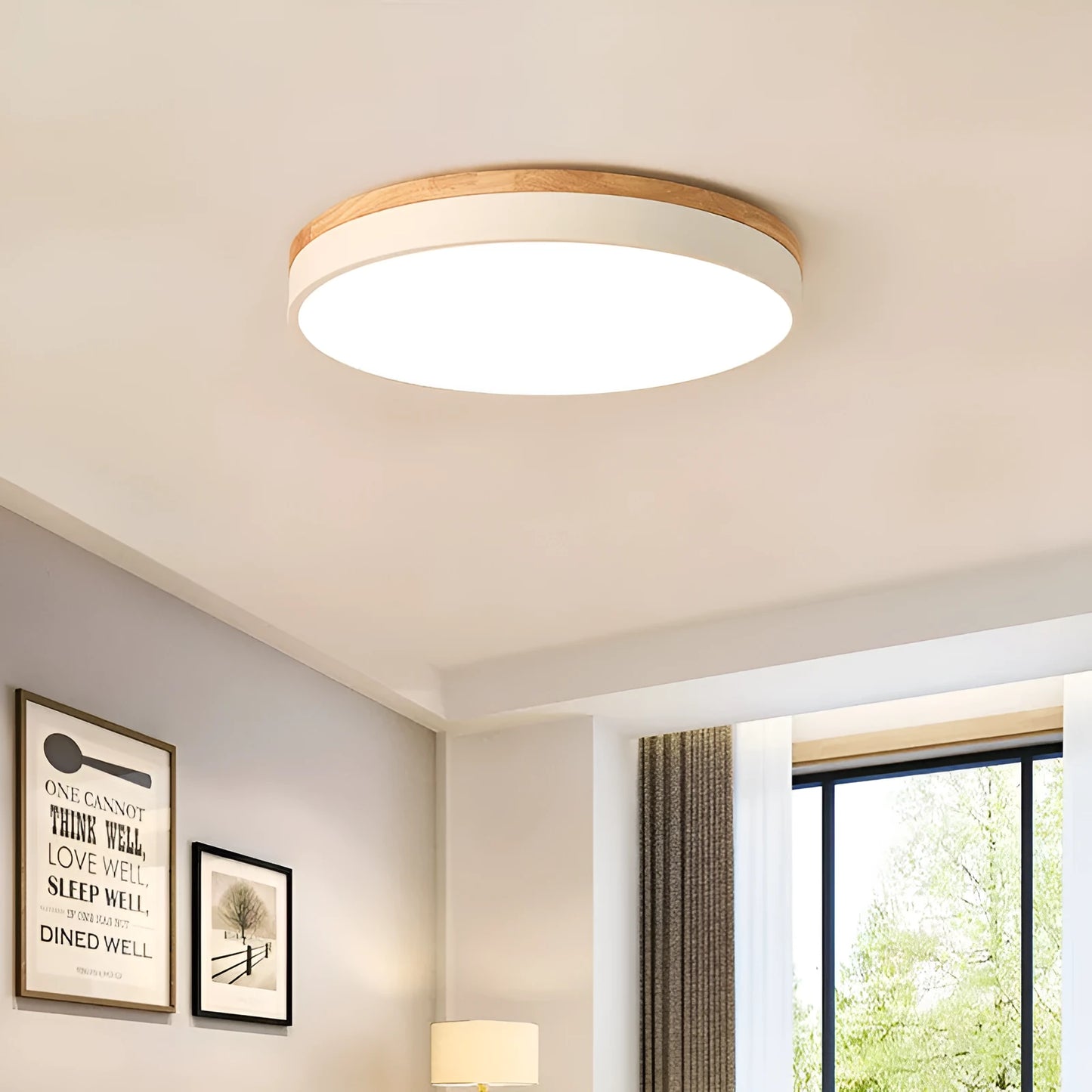 Round solid wood and acrylic LED ceiling lamp with dimming control in a modern living room setting.