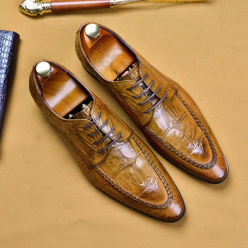 Men's black alligator pattern leather shoes with a horse bit buckle and rubber sole.