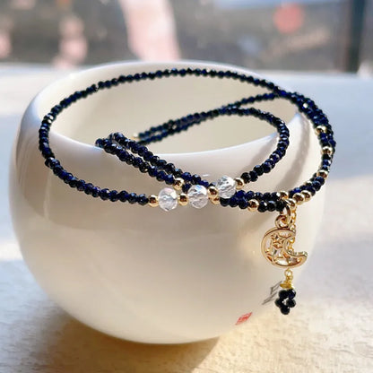 Blue gold sand stone cut three-ring multi-layer bracelet for women on a wrist.