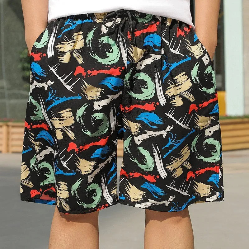 Man wearing loose-fitting striped beach pants made from quick-dry ice silk fabric.