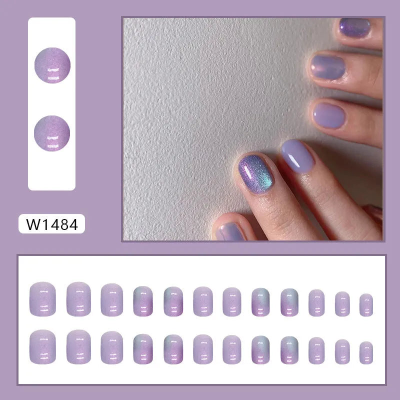 Short aurora fake nails with bright starry sky glitter pattern, 24-piece set with adhesive glue
