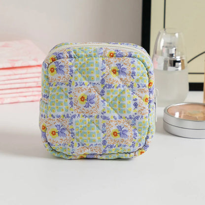 Women's key storage bag with floral patterns including cherry on white background design