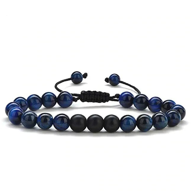 Tiger Eye and black agate geometric couple bracelets laid out as a matching set.