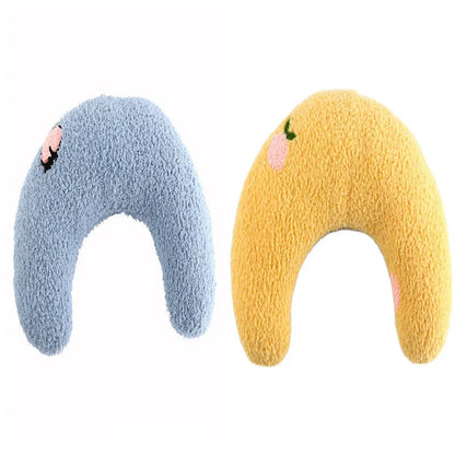 White U-shaped pet pillow measuring 27cm with raised rim supporting small cat's neck and back