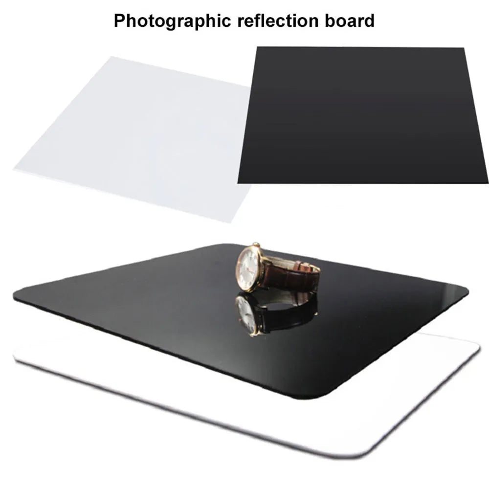 Square black and white acrylic reflection boards for product photography on a table