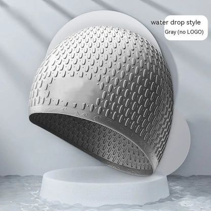 Silicone water drop swimming cap for adults shown in one of nine solid colours.